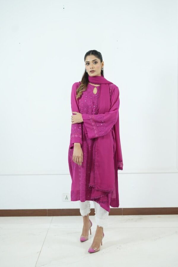 Magenta embroidered chiffon tunic with matching dupatta, paired with white lace-trimmed pants for an elegant look.