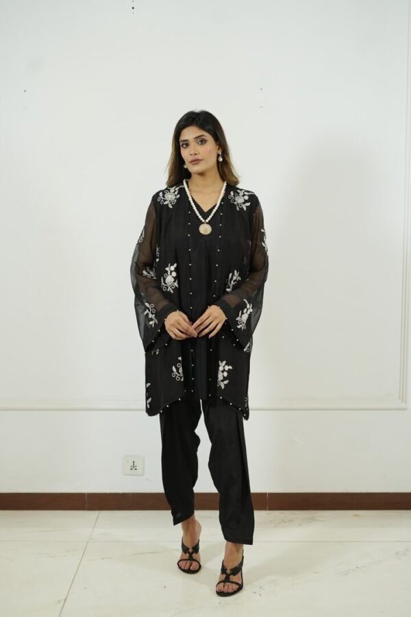 Eid new collection, best black collection,Black embroidered chiffon tunic with sheer sleeves, pearl embellishments, paired with matching straight pants and stylish sandals,Elegant and festive wear