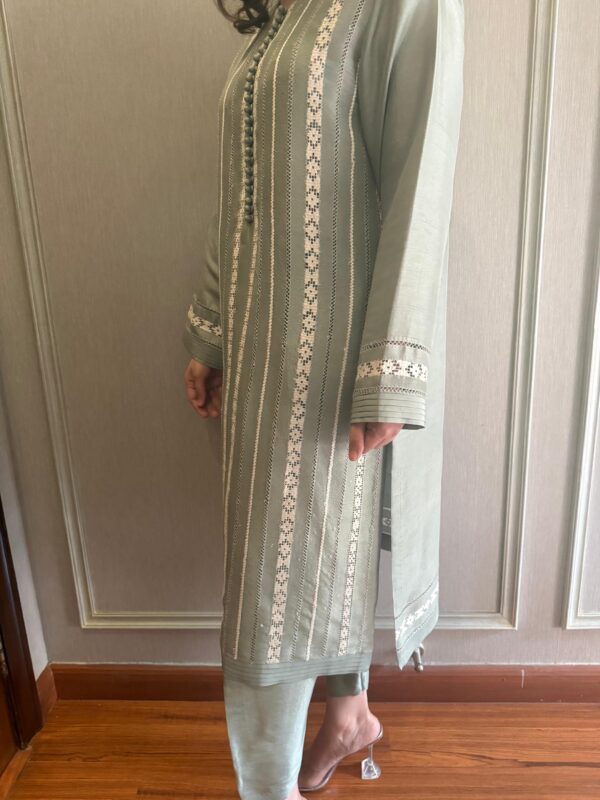 Sage green raw silk outfit with embroidered stripe detailing.